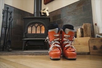 Ski boots drying in front of fireplace.
Photo : Noah Clayton