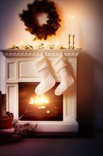 Christmas stockings on fireplace.