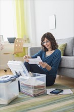 Woman doing paperwork at home.