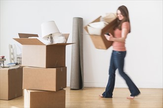 Woman moving into new home.