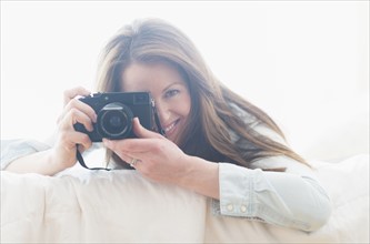 Portrait of woman photographing.