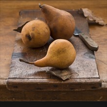 Studio shot of pears on cutting board.