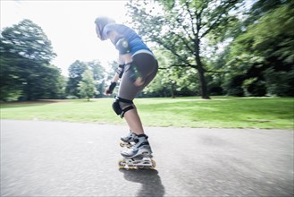 Woman roller skating in park. Netherlands.
Photo : Mark de Leeuw