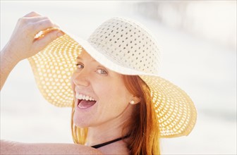 Portrait of woman wearing sun hat.