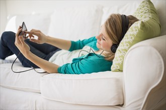 Woman watching movie on smart phone.