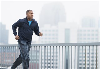 Man running in city.