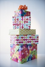 Studio Shot of stack of colorful presents.
Photo : Jamie Grill