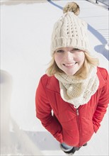 Portrait of young woman wearing knit hat in winter.
Photo : Jamie Grill