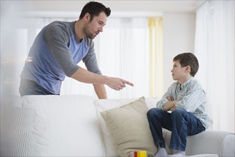Father disciplining son (8-9).
Photo : Jamie Grill