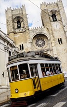 Tram in front of Lisbon Cathedral. Lisbon, Portugal.