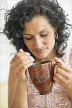 Woman enjoying her tea.