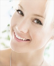 Portrait of blonde woman smiling.