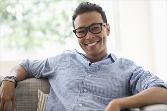 Portrait of young relaxed man smiling.