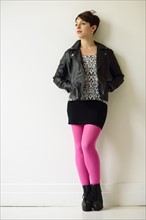 Young woman wearing pink stockings.