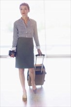 Senior business woman in airport.