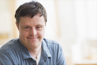Portrait of man with down syndrome.