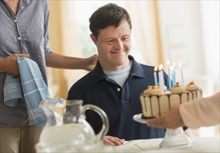 Man with down syndrome celebrating birthday.