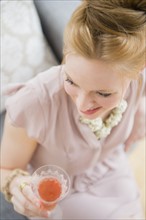 Young woman holding glass of champagne