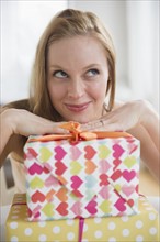 Portrait of young woman with wrapped presents