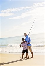 Father and son (10-11) fishing
