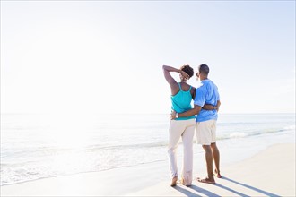 Mature couple standing on beach