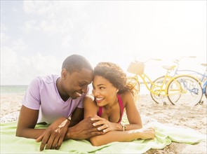 Young couple relaxing on beach