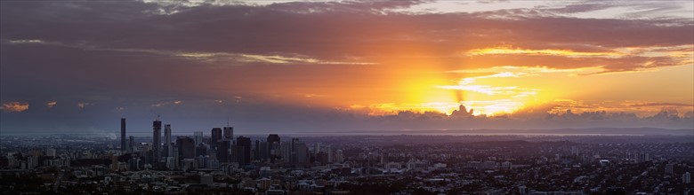 Panoramic view of city at sunrise
