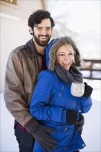 Portrait of happy couple in winter