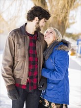 Young couple looking each other, smiling