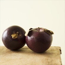Studio shot of purple apples.