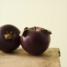 Studio shot of purple apples.
