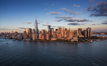 Aerial view of city with Freedom tower at sunset. New York City, New York.