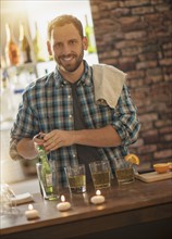 Portrait of smiling bartender.