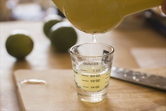 Close-up of liquid being poured into shot glass