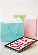 Digital tablet and shopping bags