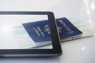 Digital tablet, airplane tickets and passport