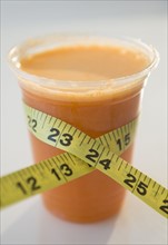 Carrot juice and tape measure