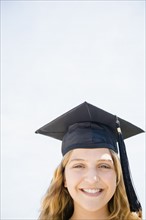 Girl (12-13) in graduation cap