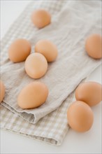 Studio shot of eggs on dishcloth