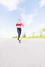 Young woman jogging in park