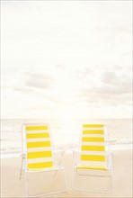 Two empty chairs on beach