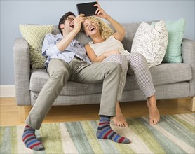 Couple using tablet pc.