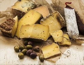 Selection of cheese on wooden table, studio shot.