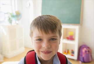 Portrait of boy (6-7) in classroom