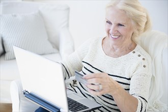 Senior woman doing on-line shopping