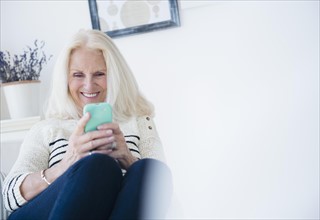 Senior woman texting