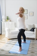 Portrait of senior woman doing yoga