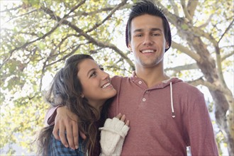 Portrait of young couple in park