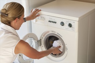 Netherlands, Goirle, Woman doing laundry