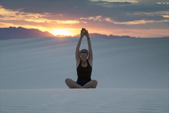 Mid-adult woman doing yoga in desert